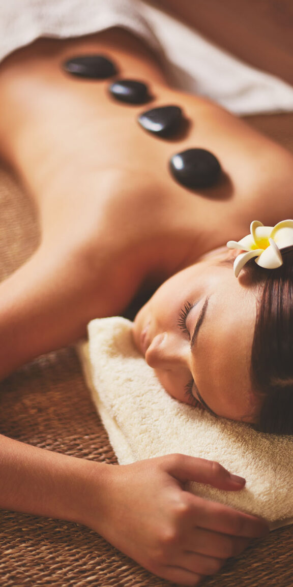 Portrait of young female lying in spa salon during beauty procedure